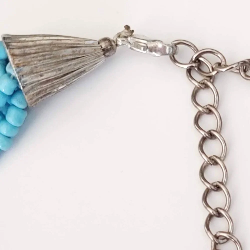 8 strand blue and silver beaded necklace